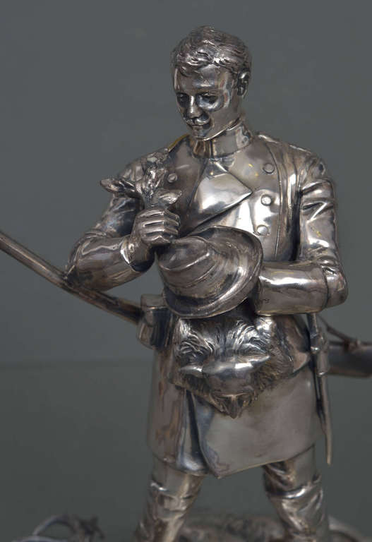 Silver-plated bronze figure on a stone base 