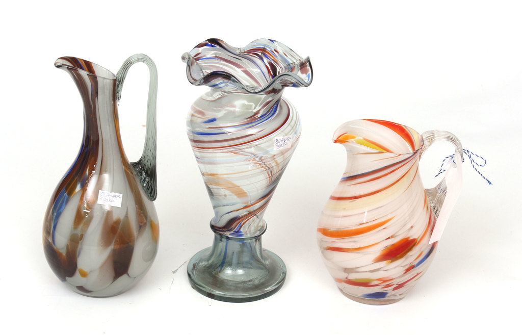 Set of colored glass pitchers and vase