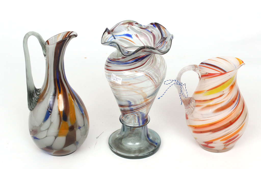Set of colored glass pitchers and vase