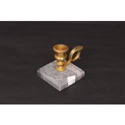 Bronze candlestick on a marble base