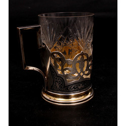 Silver glass holder with a glass