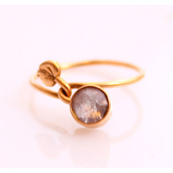 Gold ring with purple stone 