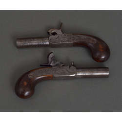 A pair of mini pocket pistols, original box