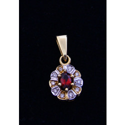 Gold pendant with diamonds and garnet