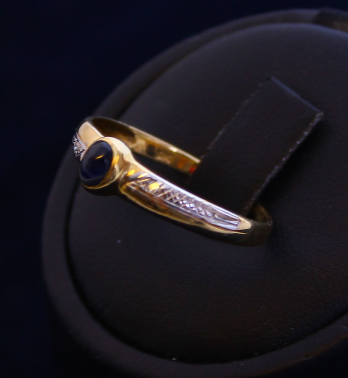 Gold ring with diamonds and sapphire