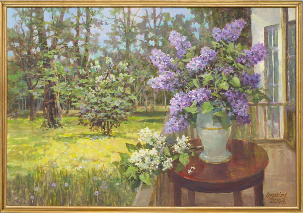 Vase of lilacs on a landscape background