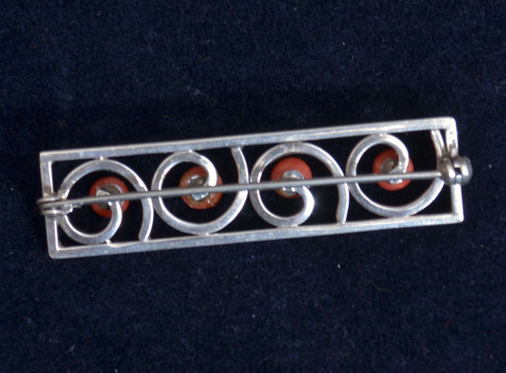 Silver Art Nouveau brooch with red coral