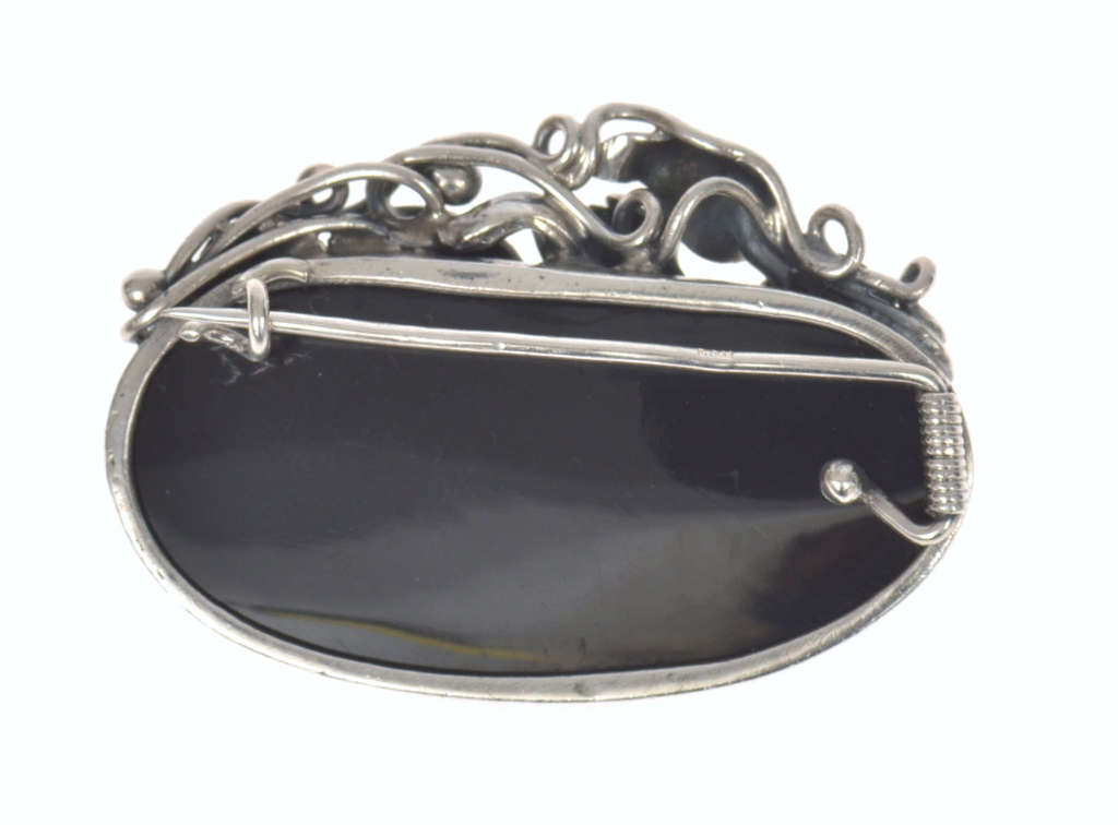 Silver brooch with black agate