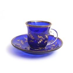 Blue glass cup with saucer