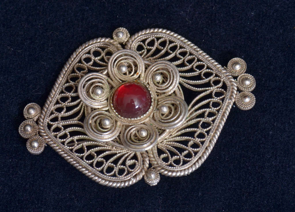 Silver containing brooch