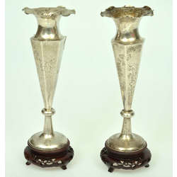 A pair of silver vases