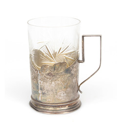 Silver glass holder with a glass