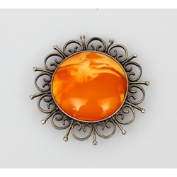 Silver Art Nouveau brooch with natural amber