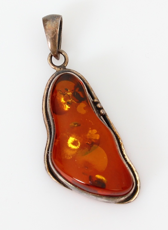 Silver Art Nouveau pendant with amber