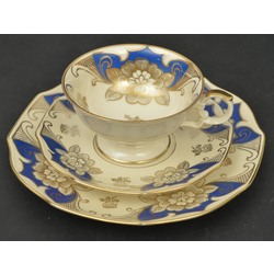 Porcelain cup with two saucers