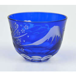 Blue glass cup with fragments of nature