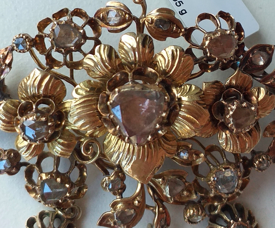 Antique gold brooch with diamonds.