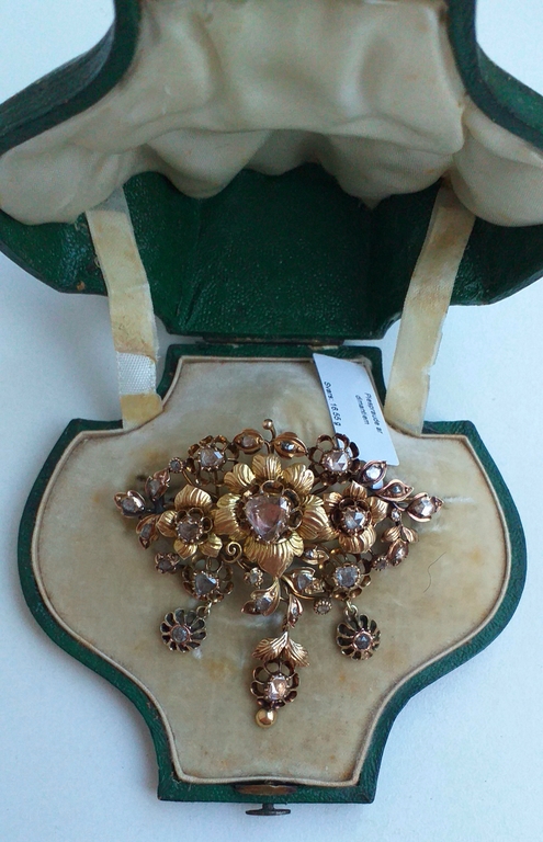 Antique gold brooch with diamonds.