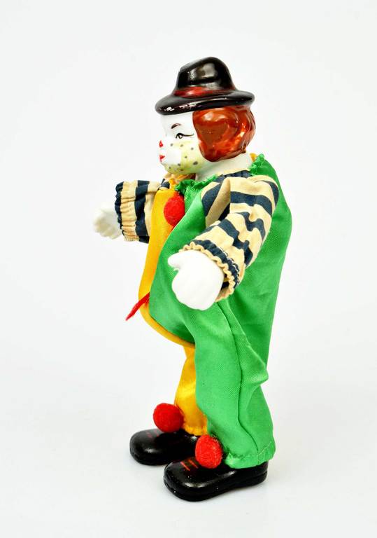 Porcelain doll clown with flexible legs and arms