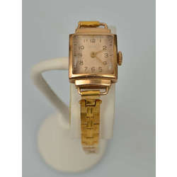 Gold wristwatch with metal strap