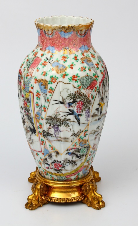 Porcelain vase on a bronze base