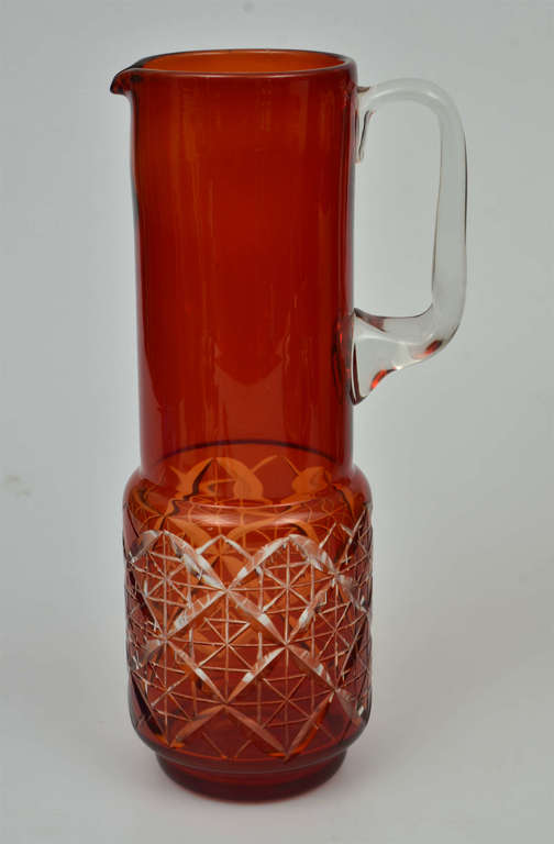 Colored glass pitcher of Ilguciems juice