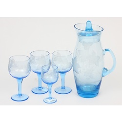 Blue glass decanter with four glasses