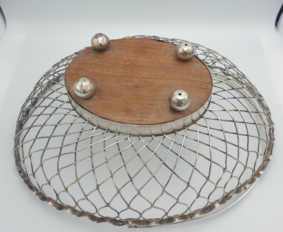 Silver fruit bowl with wooden base