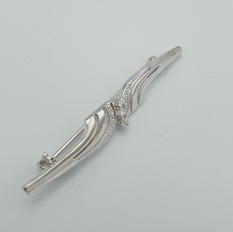 Silver brooch with zircons
