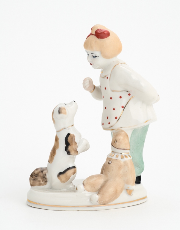 Figure. A girl with a dog and a teddy bear