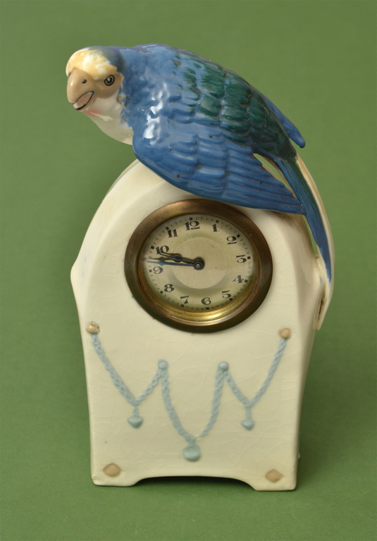 Faience clock with a parrot