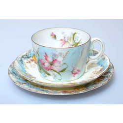 Porcelain cup with two saucers