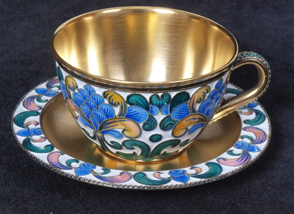 Silver cup with the saucer