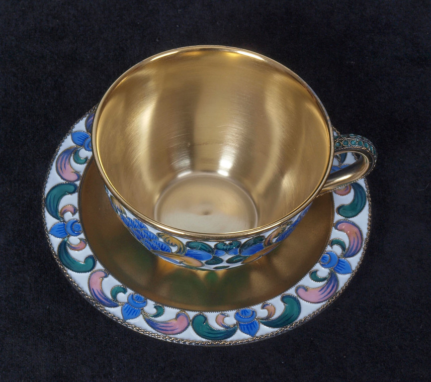 Silver cup with the saucer