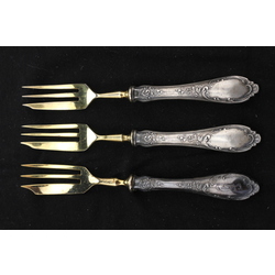 Three gilded dessert forks with silver handles