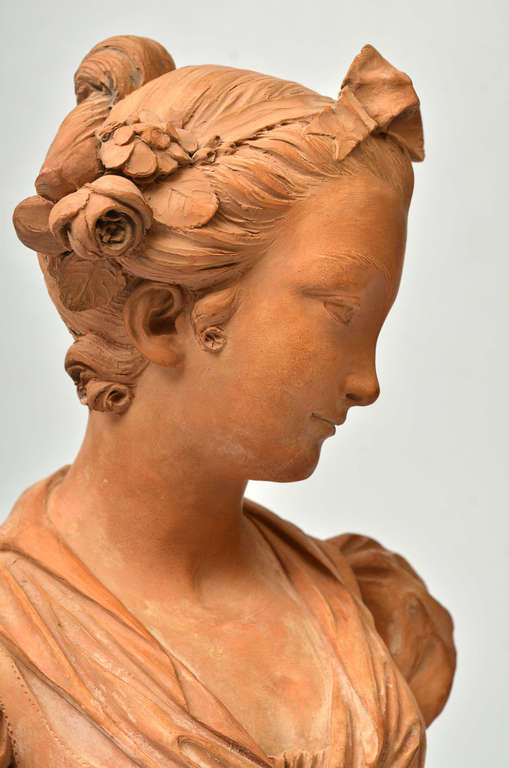 Terracotta bust on a marble base Bust of a Virgin
