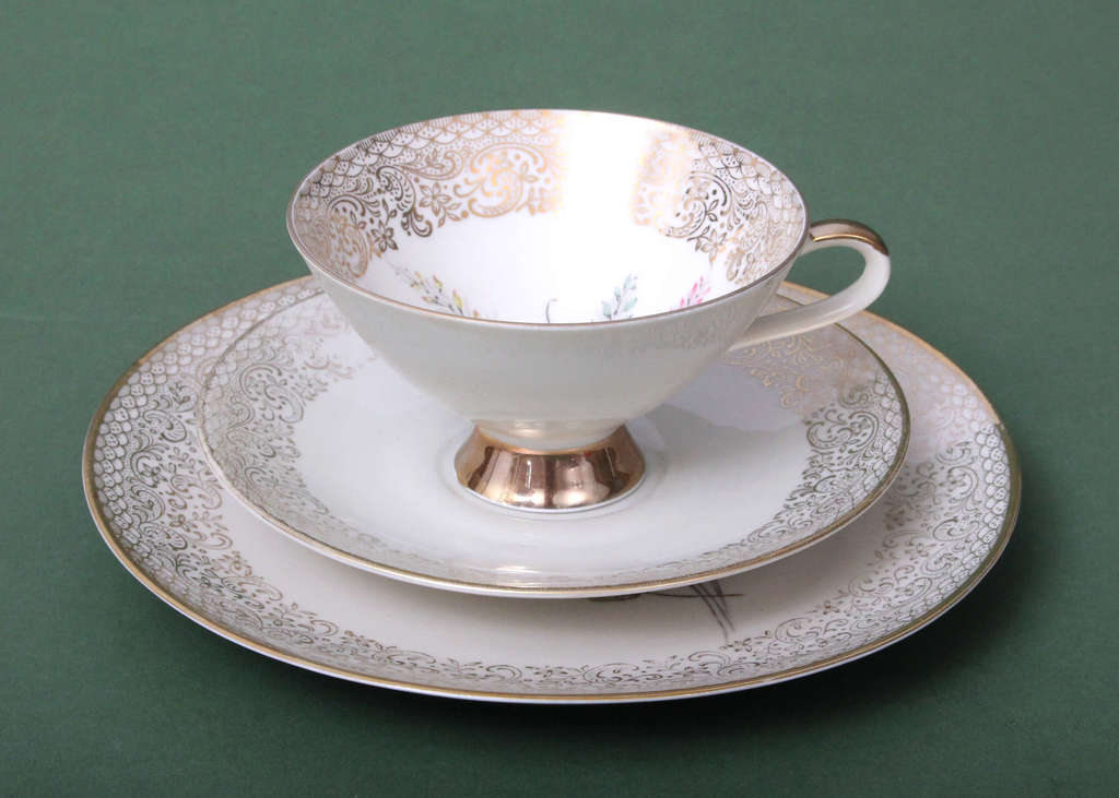 Porcelain cup with saucer and plate