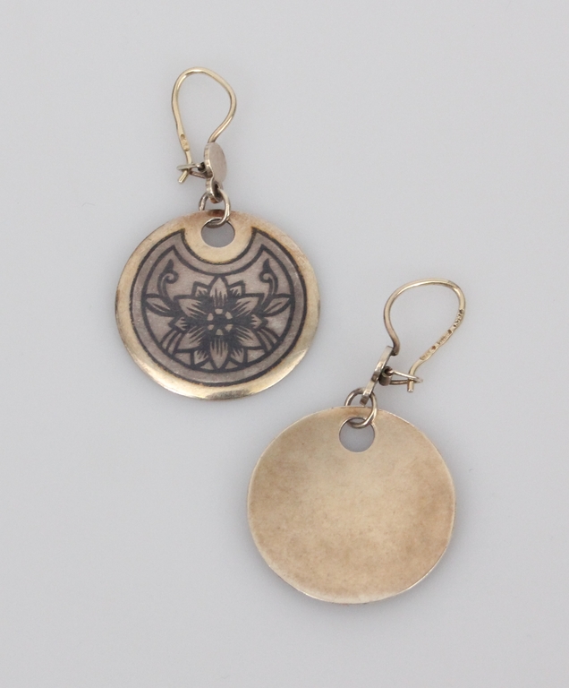 Silver earrings with a decorative pattern