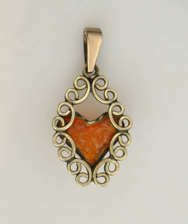 Amber pendant in metal frame 