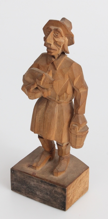 Wooden figure with a silver 