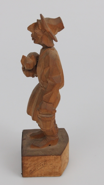 Wooden figure with a silver 