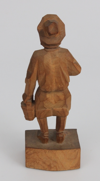 Wooden figure with a silver 