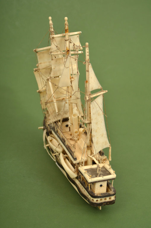 A model of a ship made of a sea lion's fang