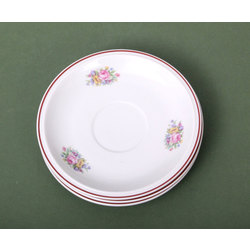 Three saucers with floral decor