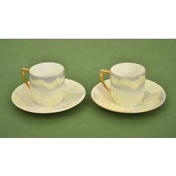 Two cups with saucers