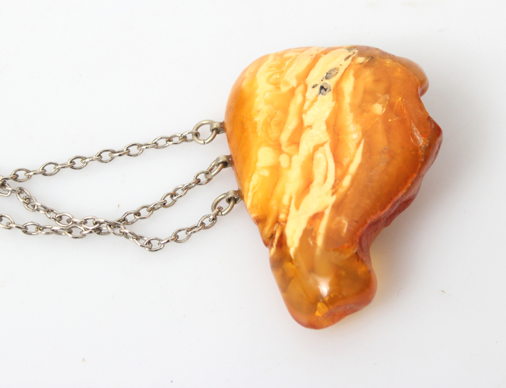 Amber brooch with metal chain
