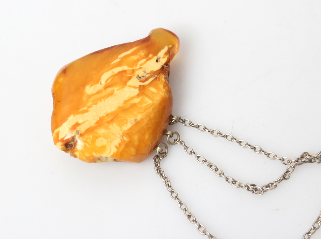 Amber brooch with metal chain