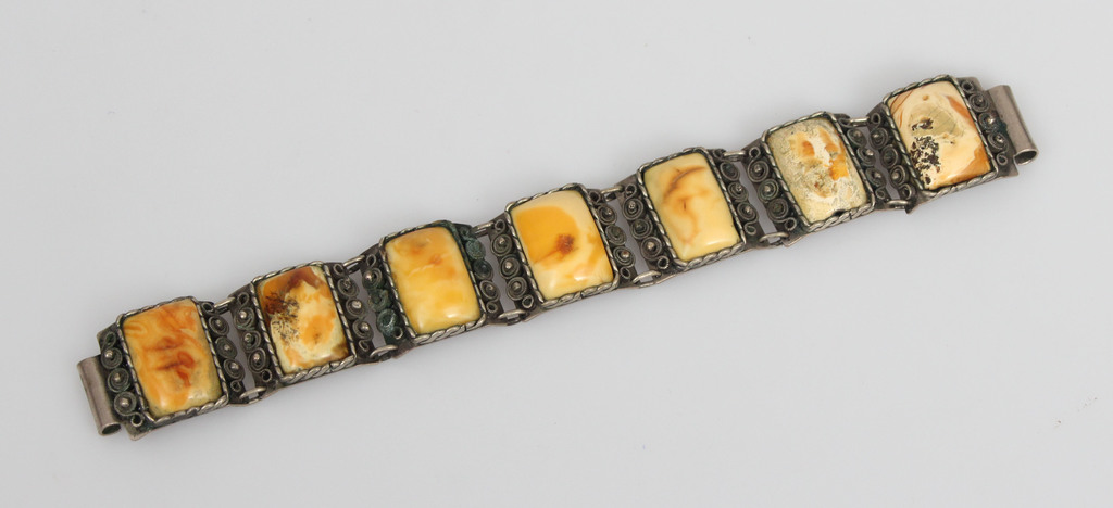 Metal bracelet with amber