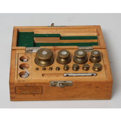 Set of brass weights in a wooden box