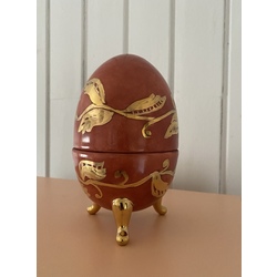 Porcelain egg with gilded painting